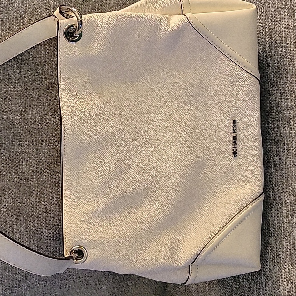 Micheal Kors pebbled leather cream colored purse.  Purse is 14x10x4